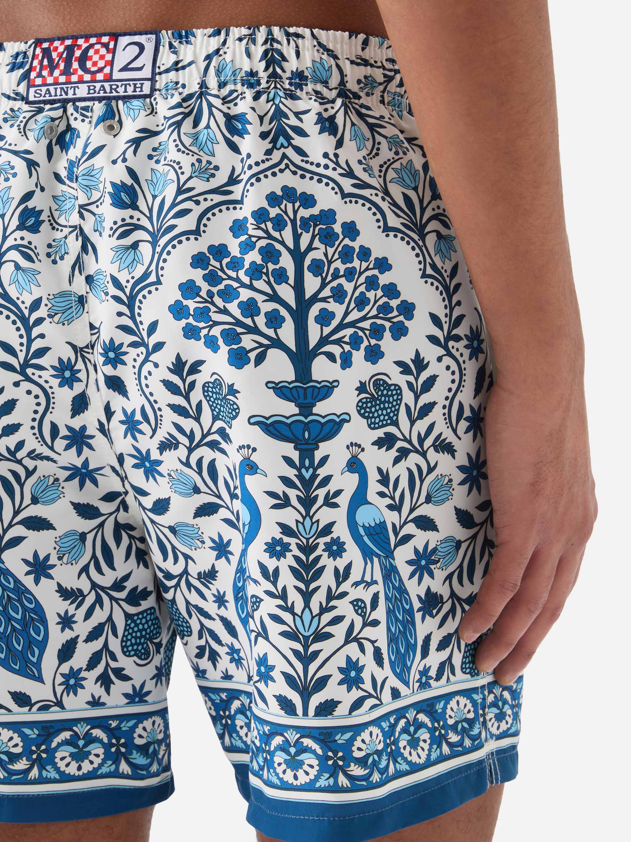 Gustavia white swim shorts with contrasting peacock print - Image 6